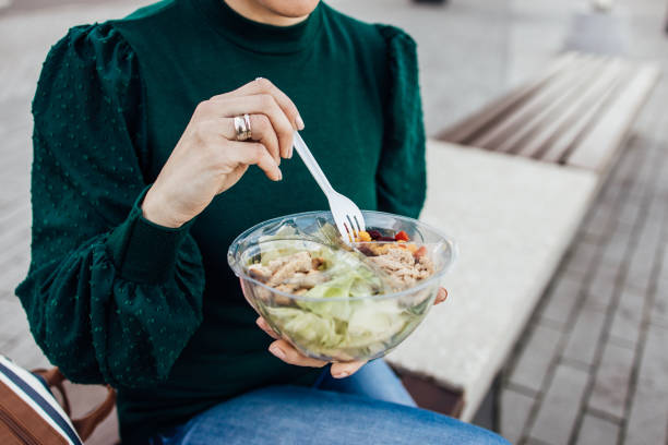 istock Unrecognizable woman eating from the plastic lunch box 1313360021