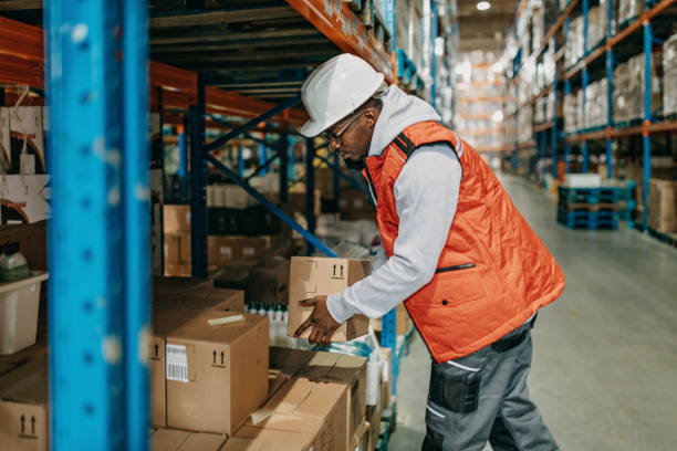 istock Young attractive man working in the warehouse 1313361263