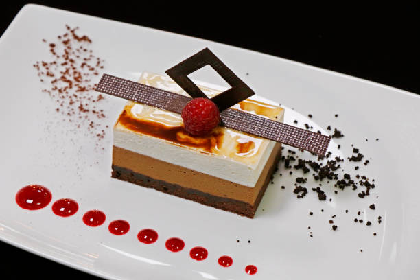 istock triple layered vanilla and chocolate mousse cake dessert 1313361567