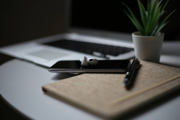 istock A notepad and a laptop on the table stock photo 1313362672