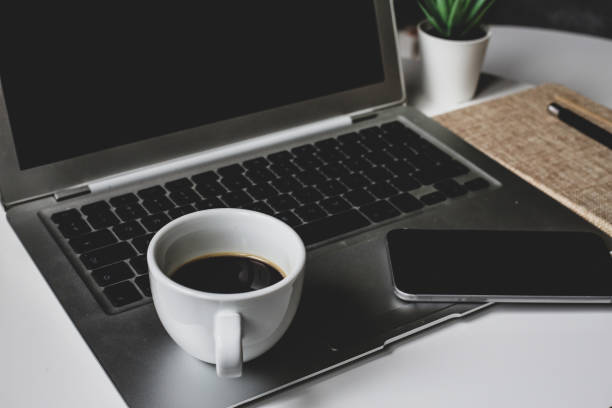istock Notebook, cup of coffee, notebooks, notes. Robot at home. White background stock photo 1313362769