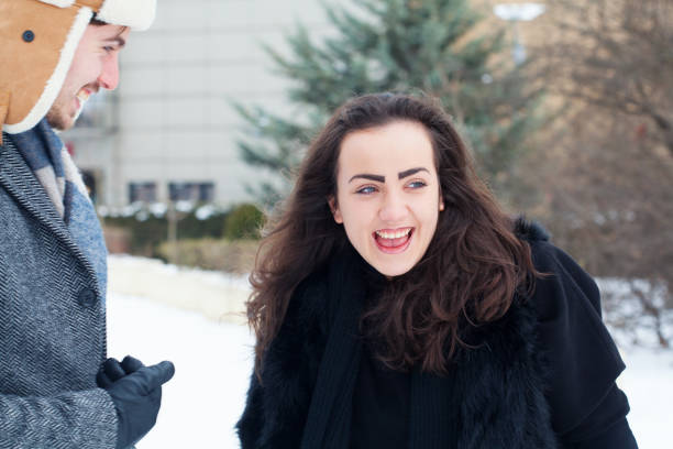 istock Young couple laughing together 1313365271