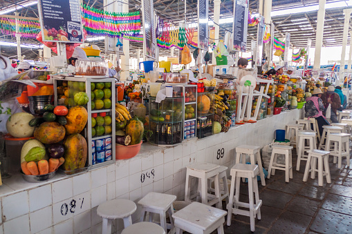 Cuzco, Peru - May 23, 2015: Fruit juice stalls in Mercado San Pedro market in Cuzco, Peru.