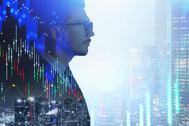 istock Businessman profile, double exposure of graph and skyscrapers 1313367514