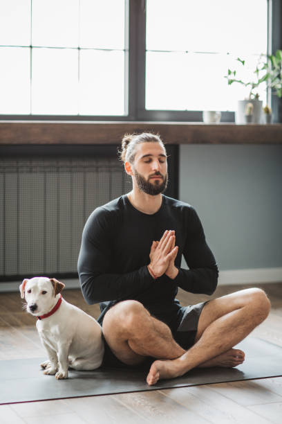 istock Young men at home practicing yoga 1313368289