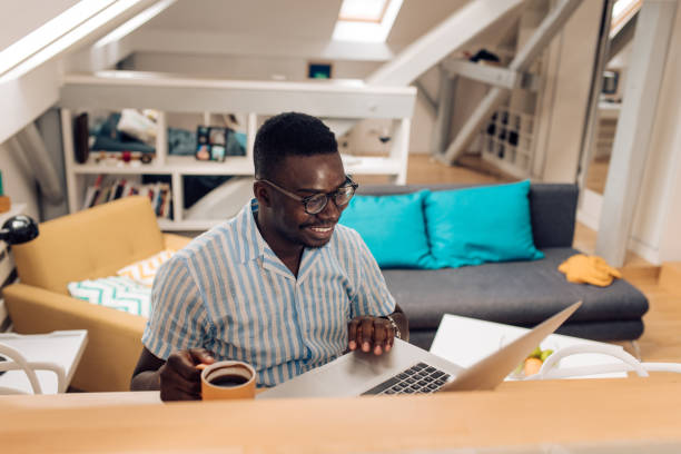 istock Happy African American student preparing the exam at home 1313368492