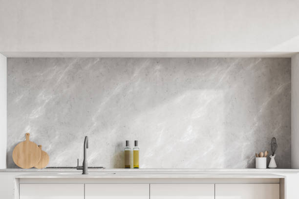 istock Modern contemporary design kitchen interior. Dining island with sink. White, marble and concrete stone material. Mock up wall copy space. 1313368609