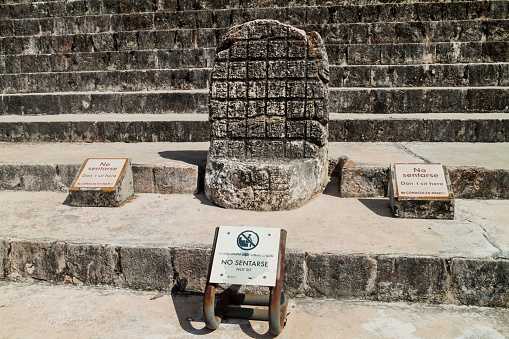 Stone throne at the Nun's Quadrangle Cuadrangulo de las Monjas building complex at the ruins of the ancient Mayan city Uxmal, Mexico