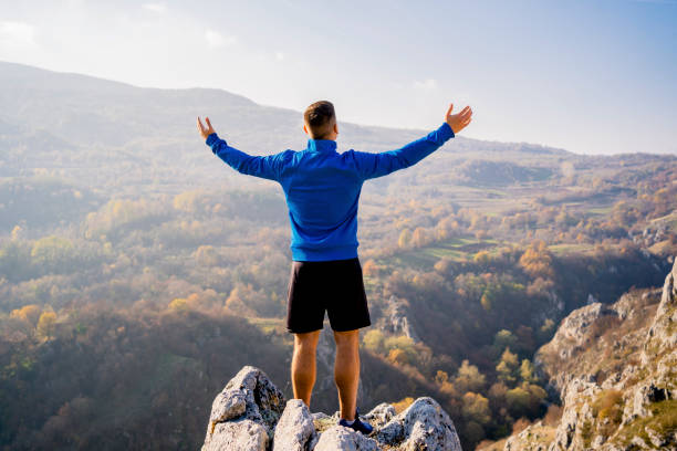 istock Man standing on top of mountain 1313373508