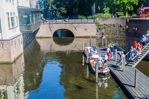 DEN BOSCH, NETHERLANDS - AUGUST 30, 2016:  Tourist boat on a canal in Den Bosch, Netherlands
