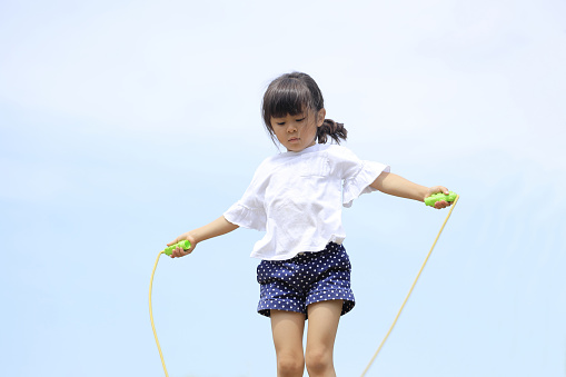 Japanese girl (5 years old) playing with jump rope