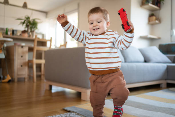 istock Smiling baby boy walking around the house 1313379368