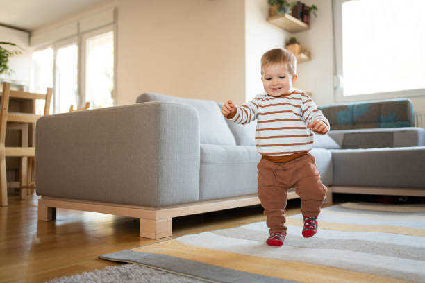 istock Cheerful little boy walking around the house 1313379384
