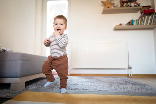 istock Cheerful toddler walking around the house 1313379424