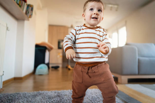 istock Cheerful toddler walking around the house 1313379426