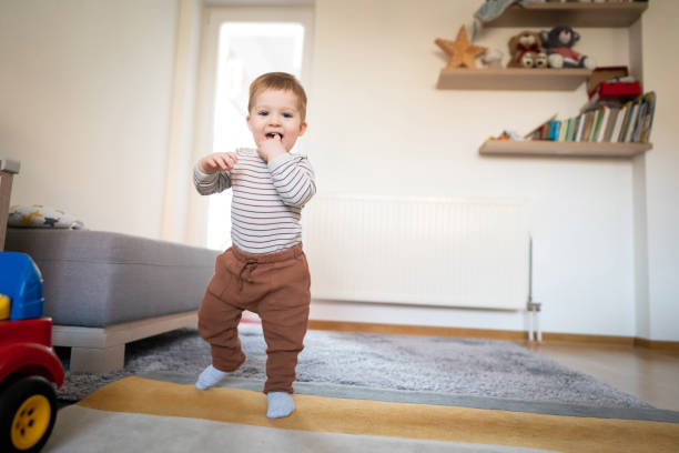 istock One happy toddler walking around the house 1313379427
