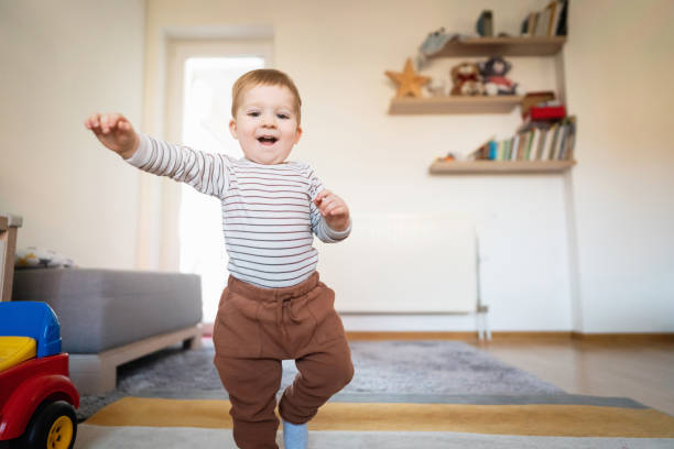 istock One happy toddler walking at home 1313379431