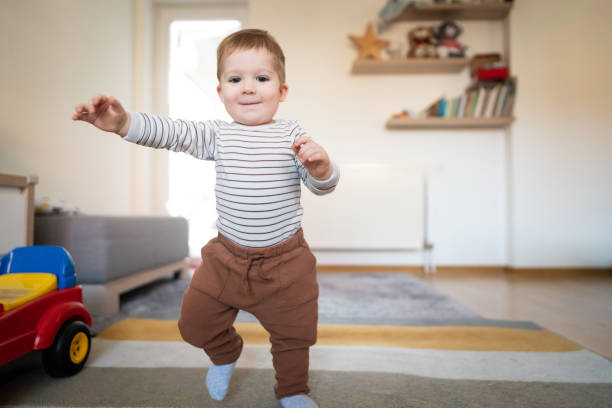 istock Cheerful toddler walking at home 1313379432