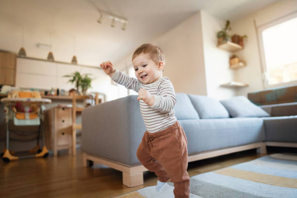 istock One happy Caucasian toddler walking at home 1313379436