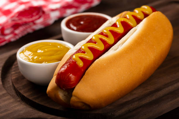 istock Hot dog with ketchup and yellow mustard. 1313385600
