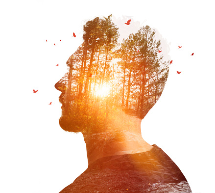 Multiple Exposure of young man and nature