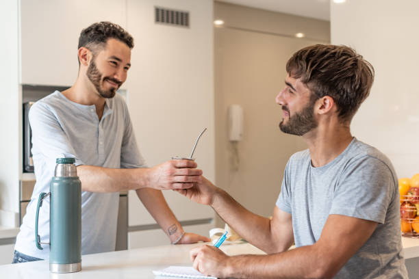 istock Two boyfriends sharing mate infusion 1313390853