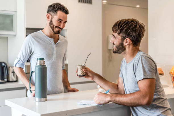 istock Two boyfriends sharing mate infusion 1313390861
