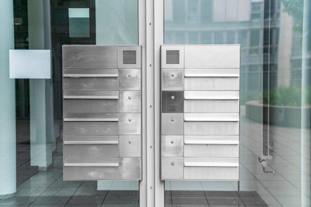Metal weaving new modern mailboxes in a row on an office building
