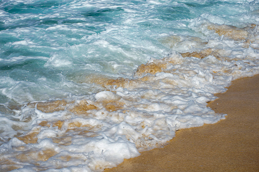 Sea foam crashing on beach, Sunset Beach, Pupukea, North Shore, Oahu, Hawaii, USA