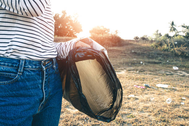istock Women garbage collection for to keep clean and take recycling. 1313395795