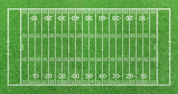 istock American football field, stripe grass with white pattern lines. Top view 1313395918