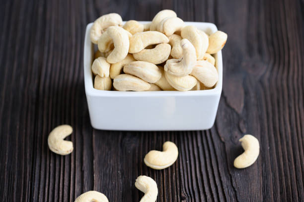 istock Full Raw Cashew Nuts in white ceramic bowl 1313397896