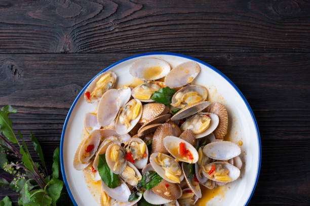 istock Stir fried Spicy Clam (Surf clam, Short necked clam, Carpet clam, Venus shell, Baby clam) with Thai Holy Basil 1313398031
