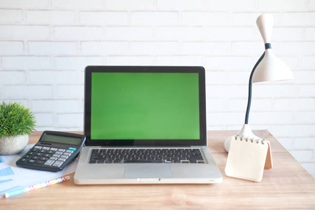 istock laptop with blank screen on office desk. 1313399939