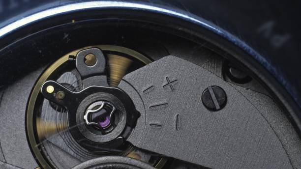 istock Watch mechanism macro loop. Old vintage clock mechanism working, closeup shot with soft focus. Close up of a internal clock mechanism. 1313401131
