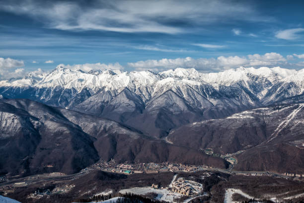 istock High mountain peaks covered with snow on a clear sunny day 1313401280