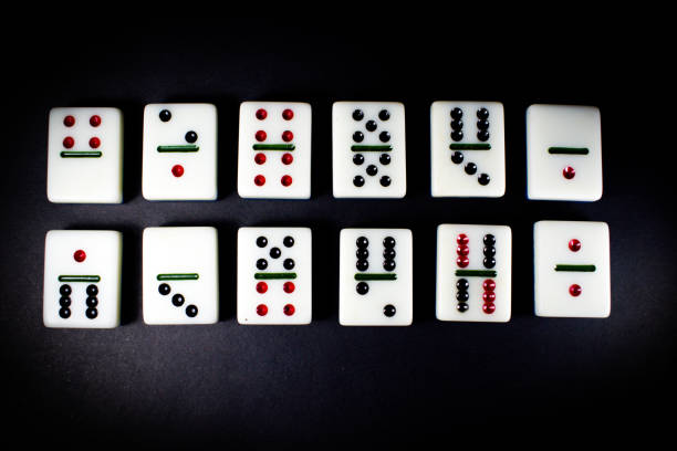 istock Dominoes, dominoes game, black background 1313402199