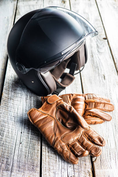 istock Safety motorcycle accessories. Leather gloves and helmet 1313403630