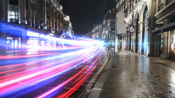 istock Rush hour traffic fast moving,Fast moving traffic drives time lapse moving fast light road lane effect line light cg 1313403746