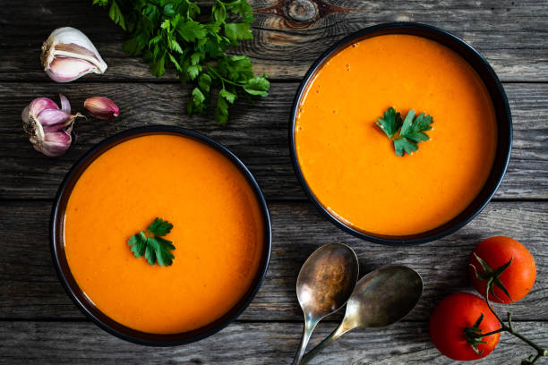 istock Cream tomato soup on wooden table 1313403795