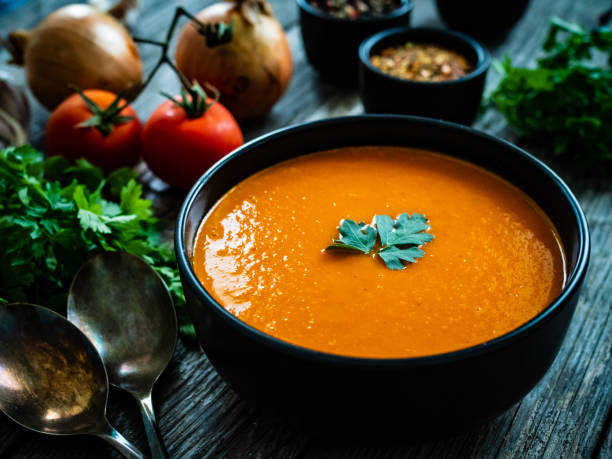 istock Cream tomato soup on wooden table 1313403804