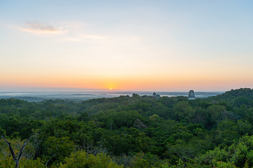 Mayan Pyramids of Tikal with the Peten tropical rainforest at sunrise,  Tikal national park, Guatemala.