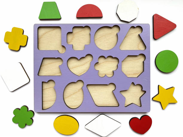 istock The developing toy an insert consisting of geometric figures isolated on white background. Children s development, toys. 1313404500