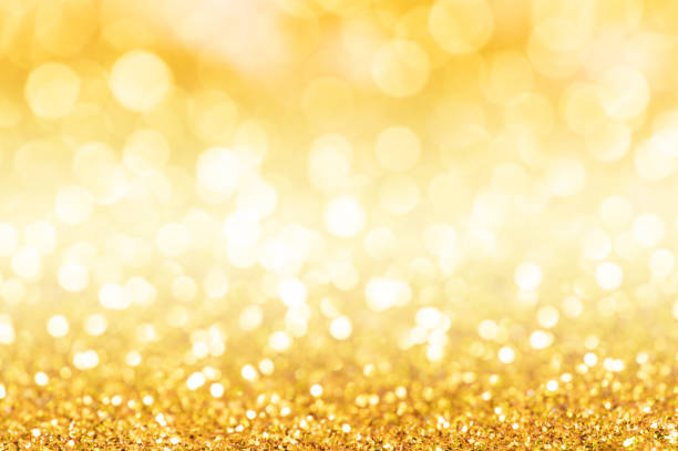 istock Gold glitter texture. Sparkling gold bright bokeh from blurred diamond dust on black background. Abstract golden bokeh background. Selective focused 1313404820