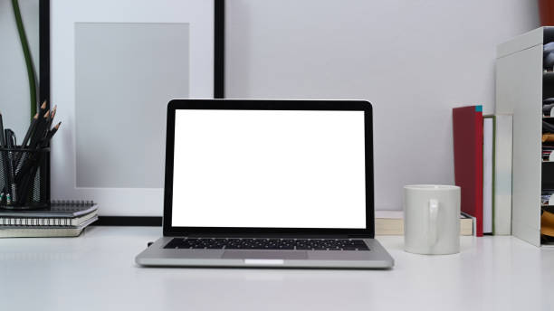 istock Mock up computer laptop with empty screen on home office desk. 1313405392