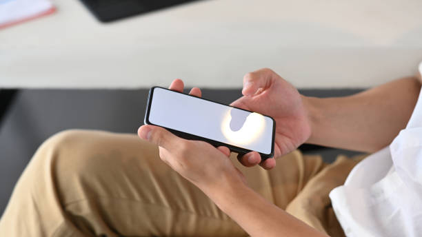 istock Close up view of casual man using smart phone for texting or massaging. 1313407304