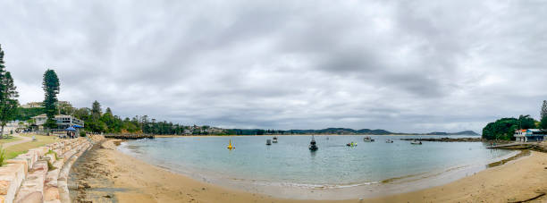 istock Beach panorama at Terrigal, NSW with storm clouds 1313408022