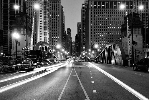 Concrete and steel details of a bridge span, perspective view. Abstract industrial architecture background. Black and white photo