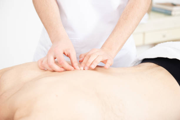 istock Physiotherapist treating a patient 1313411009