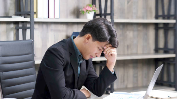 istock Asian businessman with frustrated and depressed expression while working office desk, office lifestyle 1313412819
